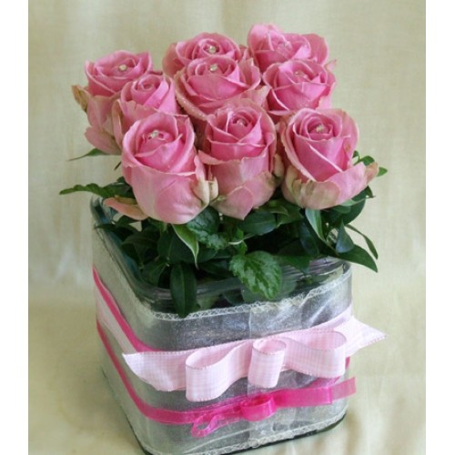 Swarovskis pink roses in a glass cube
